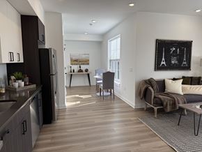 Philadelphia apartment for rent - Front Street Lofts Philadelphia PA apartments open concept kitchen and living room with stainless steel appliances and wood flooring