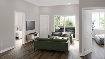Philadelphia apartment for rent - A living room with a green couch and a television.
