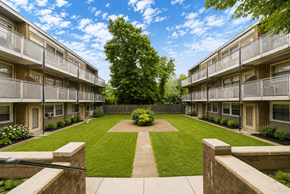 Philadelphia apartment for rent - A courtyard with a lawn and a tree in the middle of it.