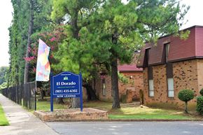 Memphis apartment for rent - A sign for El Dorado is in front of a brick building.