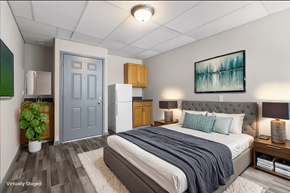 Carbondale apartment for rent - A bedroom with a bed, nightstands, and a painting on the wall.