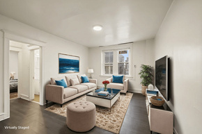 Philadelphia apartment for rent - A living room with a couch, a coffee table, and a television.