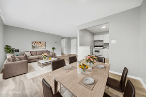 Cleveland apartment for rent - A modern dining room with a wooden table set for two.