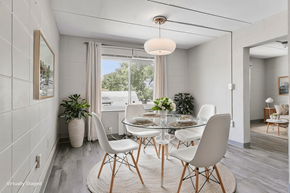 Carbondale apartment for rent - A dining room with a glass table and white chairs.