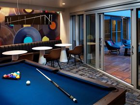 Seattle apartment for rent - a games room with a pool table and tables
