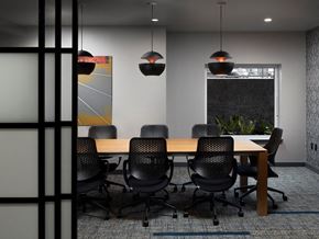Seattle apartment for rent - a conference room with a wooden table and black chairs