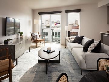 Seattle apartment for rent - a living room with a couch and a coffee table    and a balcony