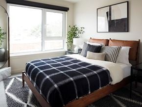 Seattle apartment for rent - a black and white checkered blanket on a bed in a bedroom