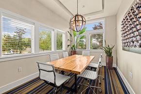Gig Harbor apartment for rent - a dining room with a table and chairs and windows