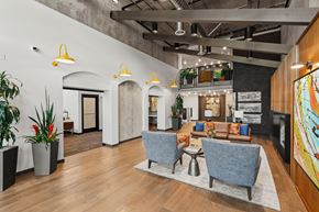 Kent apartment for rent - A modern office space with a wooden floor and a large mural on the wall.