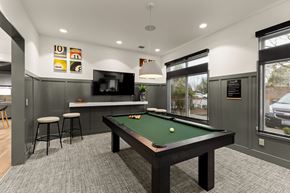 Fife apartment for rent - A pool table is in the middle of a room with a bar and stools.