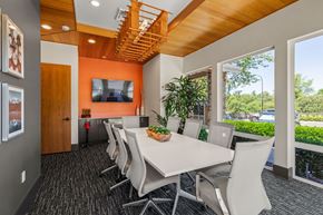 Covington apartment for rent - A conference room with a long table and chairs.