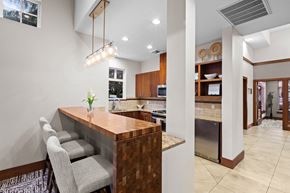 Maple Valley apartment for rent - a kitchen with a bar and chairs in a house