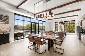 Federal Way apartment for rent - a dining room with a long wooden table and chairs and large windows