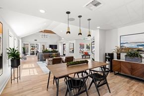 Seattle apartment for rent - A modern dining area with a wooden table and chairs.