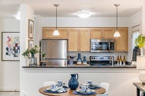 Seattle apartment for rent - A modern kitchen with a table set for two.