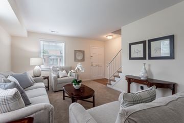 North Chesterfield apartment for rent - A living room with a grey couch and a coffee table.