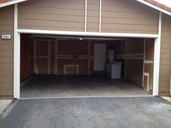 Inside of a garage with the door open