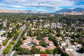 Concord apartment for rent - a neighborhood of houses and trees with mountains in the background at Greentree Terrace Apartments, CONCORD, 94521
