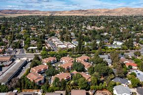 Concord apartment for rent - an aerial view of a neighborhood of houses with trees and mountains in the background at Greentree Terrace Apartments, CONCORD, CA, 94521