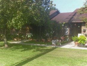 Lafayette apartment for rent - a house with a yard and trees in front of it