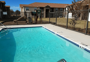 Sweetwater apartment for rent - A swimming pool in a residential area with a fence around it.