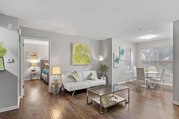 San Marcos apartment for rent - A living room with a white couch and a glass coffee table.