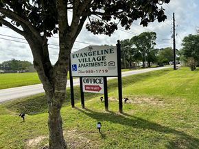 Lafayette apartment for rent - a sign that reads evangeline village apartments