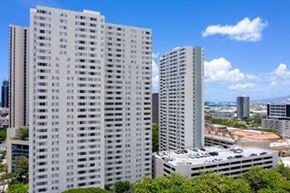 Honolulu apartment for rent - a group of tall buildings sitting next to each other