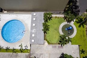 Honolulu apartment for rent - an aerial view of a pool and a park