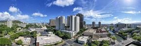 Honolulu apartment for rent - a city with many tall buildings and trees