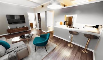 Austin apartment for rent - A modern living room with a blue chair and a grey couch.