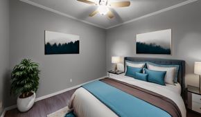 Austin apartment for rent - a bedroom with a bed and a ceiling fan
