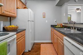 San Antonio apartment for rent - a kitchen with white appliances and granite counter tops