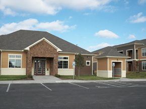 San Angelo apartment for rent - A building with a parking lot in front of it.