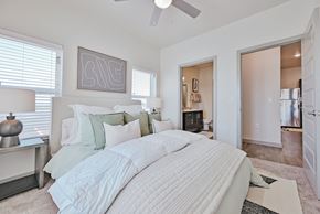 Lockhart apartment for rent - A bedroom with a large bed and a ceiling fan at Lockhart Farms Apartments, Lockhart
