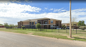 San Angelo apartment for rent - A building with a black fence in front of it.