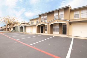 Round Rock apartment for rent - an empty parking lot in front of a building