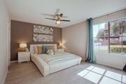 Austin apartment for rent - a bedroom with a bed and a ceiling fan