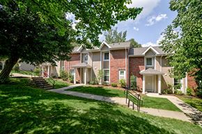 Corry apartment for rent - exterior building brick townhomes with sidewalk