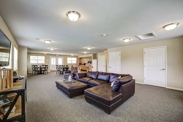Corry apartment for rent - A living room with a brown couch and a coffee table.