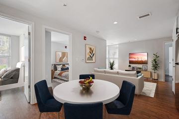 Washington apartment for rent - a living room with a white table and chairs