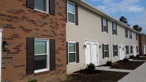 Thurman apartment for rent - a brick building with a sidewalk in front of it