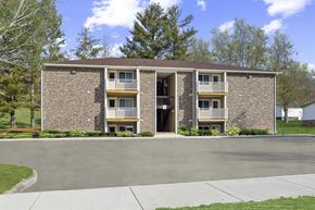 Bluefield apartment for rent - A brick building with a balcony on the second floor.