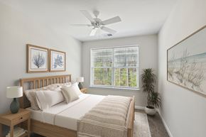 Queenstown apartment for rent - a bedroom with a bed and a ceiling fan
