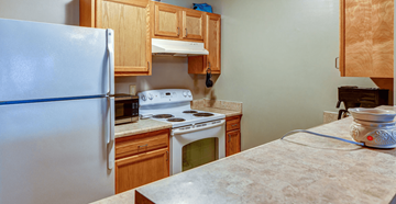 Upper Sandusky apartment for rent - a kitchen with a stove and a refrigerator