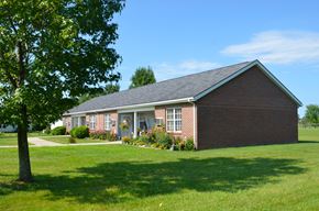 Peebles apartment for rent - a brick house with a lawn and a tree