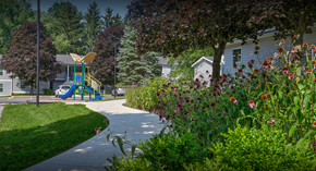 Colon apartment for rent - a sidewalk leading to a playground in front of a house