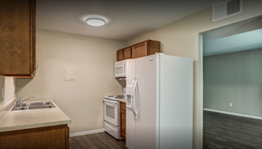 Colon apartment for rent - a kitchen with a refrigerator and a sink
