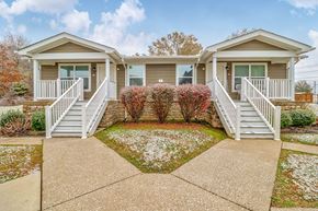 Dawson Springs apartment for rent - the front of a house with a porch and stairs